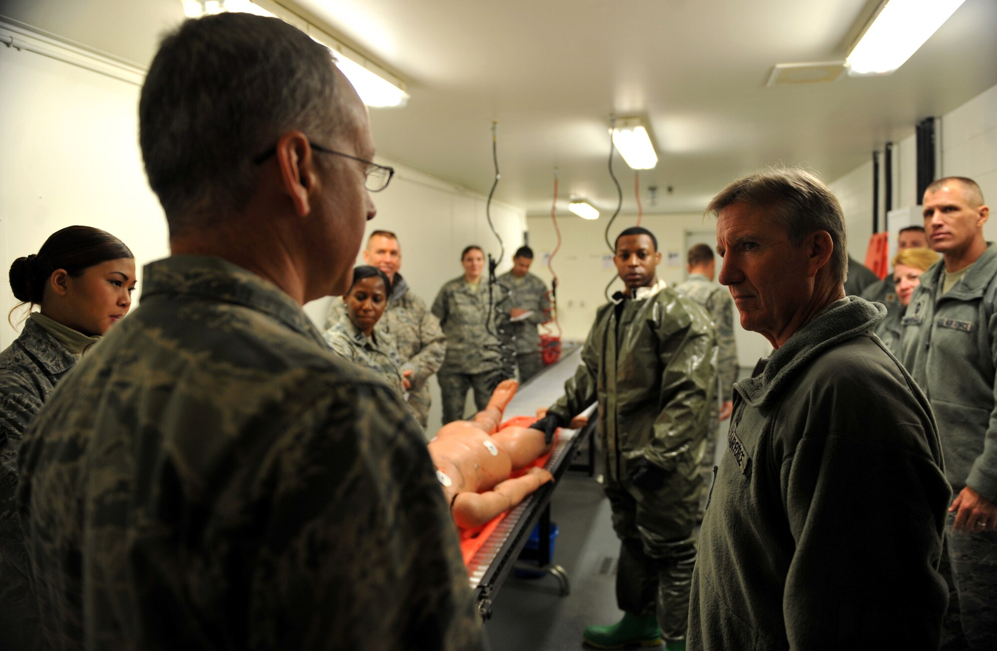 Gen. Hawk Carlisle, Pacific Air Forces commander, listens to a brief from Col. Rawson Wood, 51st Medical Group commander, at Osan Air Base, Republic of Korea, Jan. 23, 2014. Carlisle was given a demonstration of decontamination procedures 51st MDG decontamination teams would follow before admitting potentially chemically-contaminated patients into the hospital. (U.S. Air Force photo/Senior Airman Siuta B. Ika)