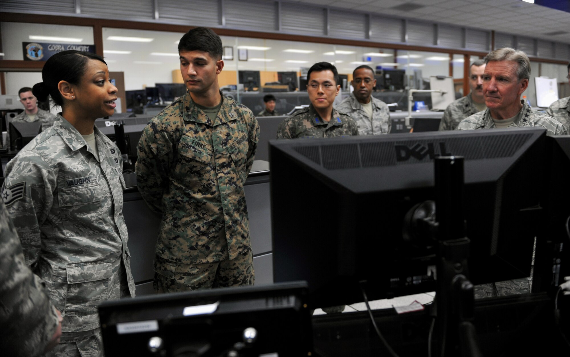 Staff Sgt. Terisha Vaughn, 621st Air Control Squadron, briefs Gen. Hawk Carlisle, right, commander of Pacific Air Forces, at Osan Air Base, Republic of Korea, Jan. 22, 2014. Carlisle received briefings from members of the 621st ACS, 607th Air and Space Operations Center, and 694th Intelligence, Surveillance and Reconnaissance Group during his tour of Osan’s 7th Air Force units. (U.S. Air Force photo/Senior Airman Siuta B. Ika)