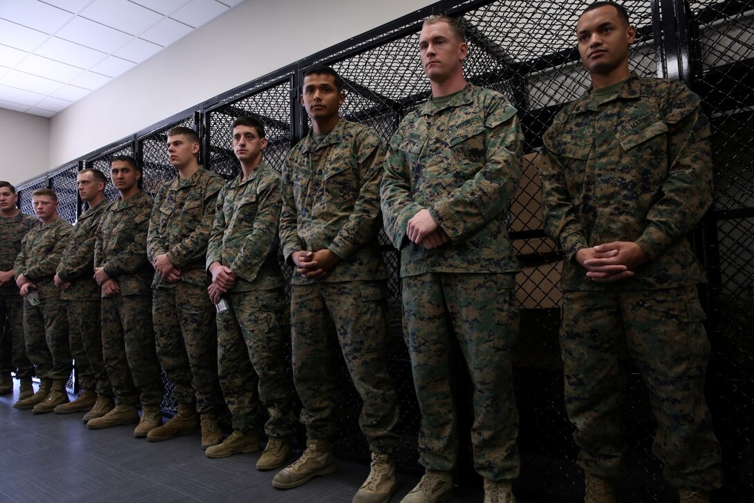 U.S. Marines with 1st Air Naval Gunfire Liaison Company listen to the introduction of the Japan Ground Self-Defense Force during Exercise Iron Fist 2014 aboard Camp Pendleton, Calif., Jan. 23, 2014. Iron Fist 2014 is an amphibious exercise that brings together Marines and sailors from the 15th Marine Expeditionary Unit, other I Marine Expeditionary Force units, and soldiers from the JGSDF, to promote military interoperability and hone individual and small-unit skills through challenging, complex and realistic training. (U.S. Marine Corps photo by Lance Cpl. Anna K. Albrecht/Released)