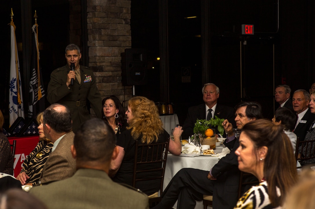Brig. Gen. John W. Bullard expresses his appreciation for the volunteers from the surrounding community during this year’s Camp Pendleton Armed Forces YMCA Board Installation and Volunteer Recognition Dinner by marching on the colors at the Pacific Views Event Center, Jan 24. The dinner honors Pendleton’s volunteers, and awards civilian and military volunteer of the year, and volunteer unit of the year. Bullard is the commanding general of Marine Corps Installation West, Marine Corps Base Camp Pendleton.