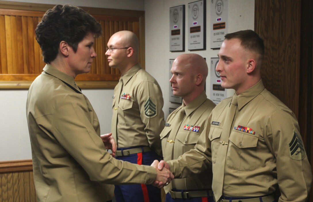 Brig. Gen. Lori E. Reynolds, the commanding general of Eastern Recruiting Region and Marine Corps Recruit Depot Parris Island, S.C., shakes hands with Sgt. Simon Jachowdik, a recruiter assigned to Recruiting Substation Patchogue, Recruiting Station New York, during her visit to the RS Headquarters, Jan. 27.  Reynolds spoke with the Marines about the importance of the recruiting effort, how that is the beginning of the transformation from civilian to Marine, and how to sustain that transformation.  (U.S. Marine Corps photo by Sgt. Caleb Gomez).