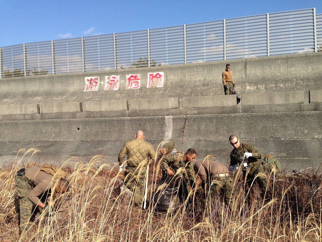 Fuji personnel clean up Numazu Beach.