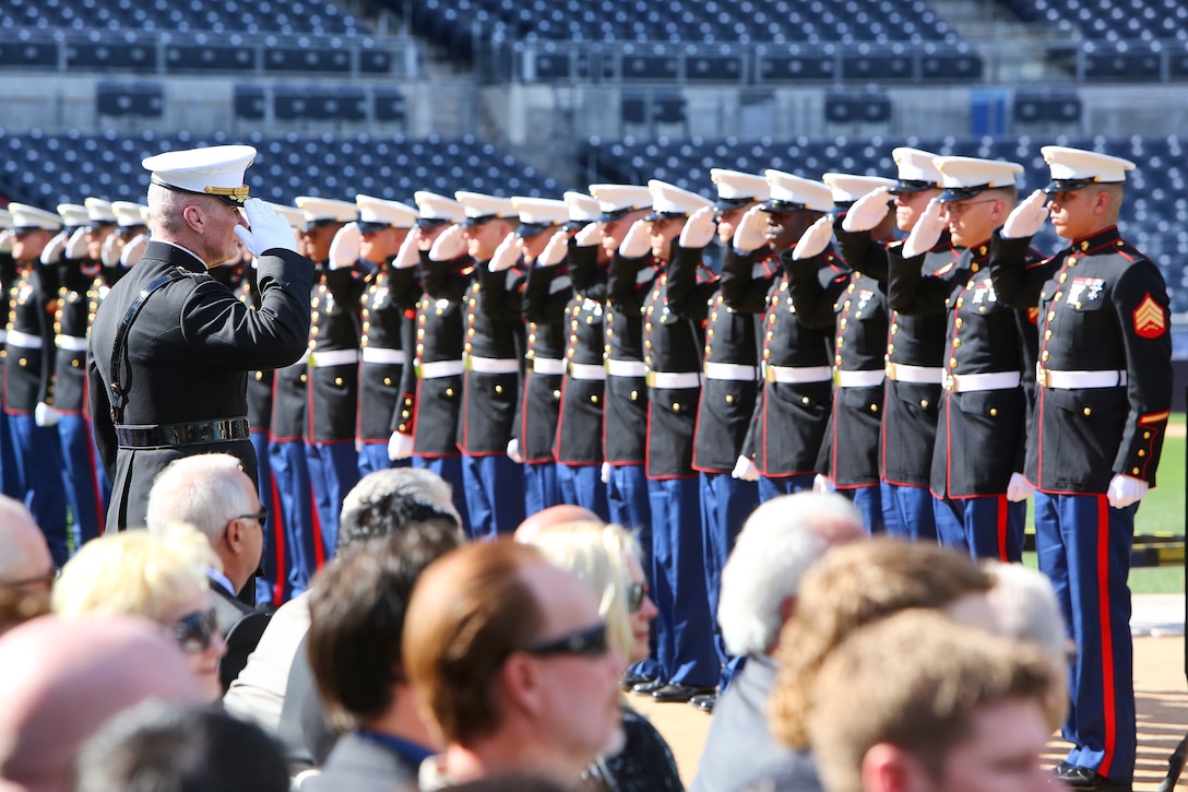 Marines and sailors with 1st Marine Logistics Group, 3rd Marine Air Wing and Marine Corps Air Station Miramar, salute Lt. Gen. John A. Toolan, the commanding general of 1st Marine Expeditionary Force, during a memorial service for Lt. Col. Jerry Coleman at PETCO Park in San Diego, Calif., Jan. 18. To commemorate the life of the baseball hall of famer and Marine veteran, the service members rendered military honors including an F/A-18E flyover, 21-gun salute and the playing of taps by a lone bugler.