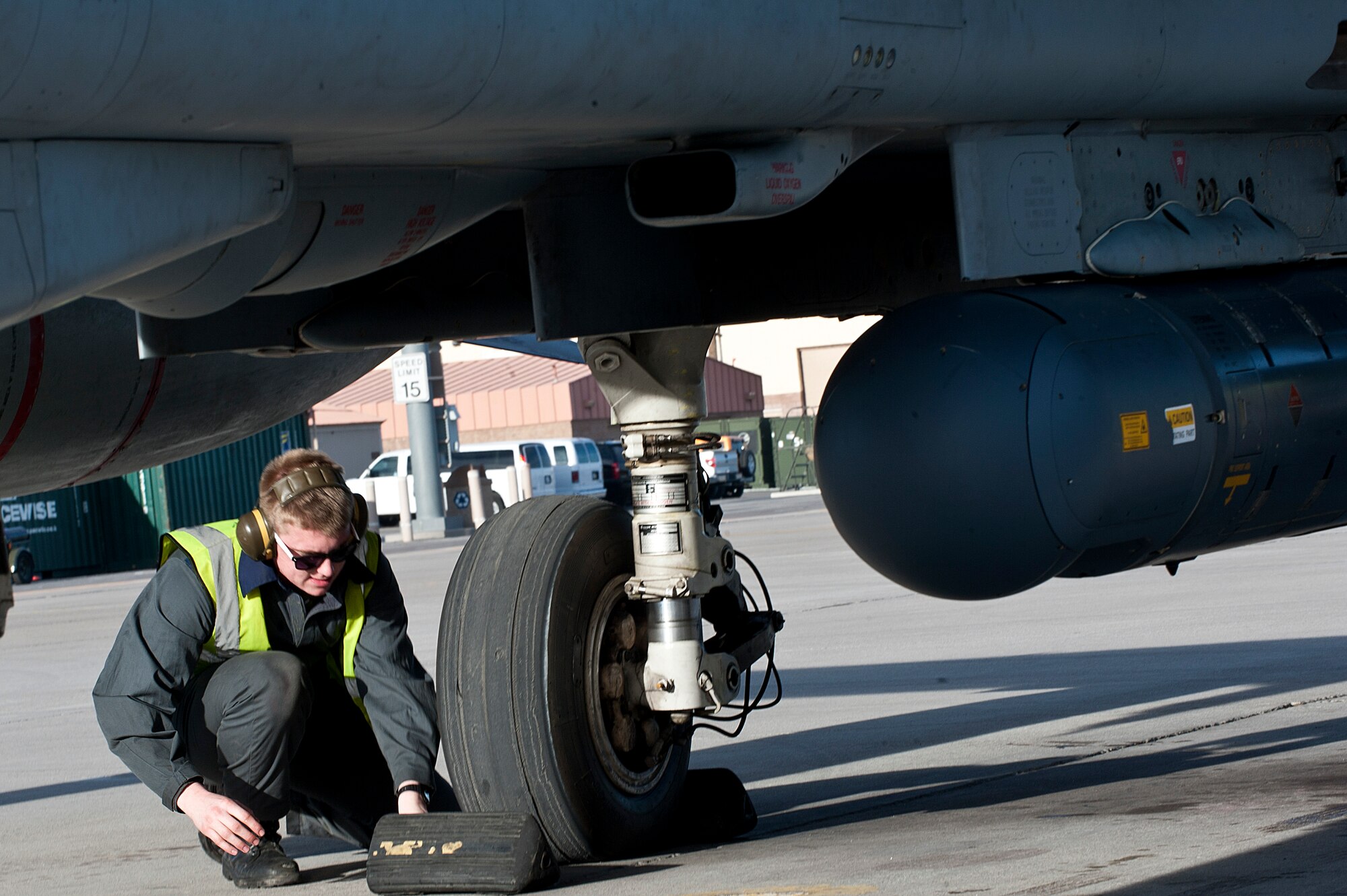 Royal Air Force Senior Air Craftsman Josh Dales, IX (B) Squadron aircraft maintenance mechanic, from RAF Marham, United Kingdom, puts chalks under the wheels of a GR4 Tornado during Red Flag 14-1 Jan. 27, 2014, at Nellis Air Force Base, Nev. Red Flag is a realistic combat training exercise involving the air forces of the United States and its allies. (U.S. Air Force photo by Senior Airman Matthew Lancaster)