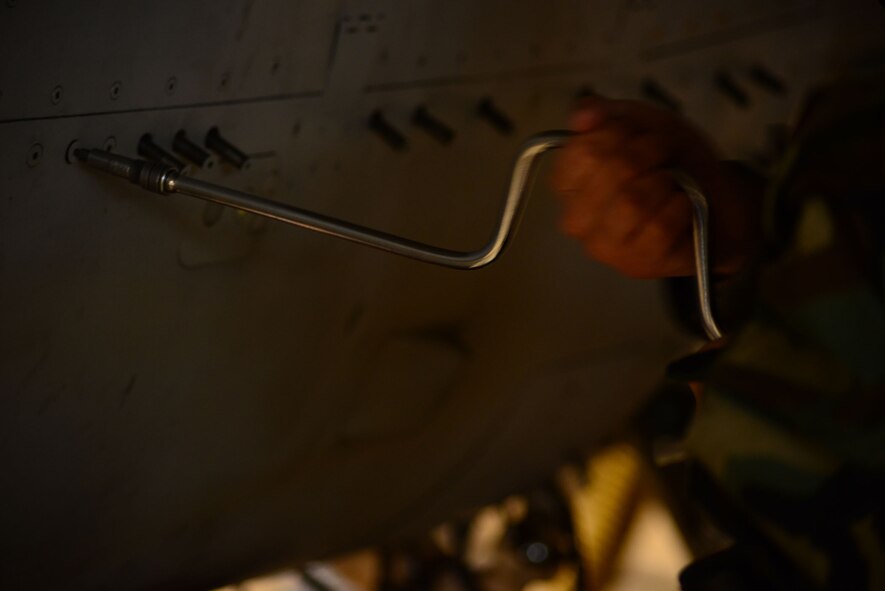 U.S. Air Force Senior Airman Cody Puente, 35th Maintenance Squadron crew chief/phase inspection team member, secures a panel on an F-16 Fighting Falcon after inspecting the power take-off shaft and the constant speed drive/main generator assembly during an operational readiness exercise on Misawa Air Base, Japan, Jan. 27, 2014. A phase inspection breaks down every part of a jet to ensure any repairs needed, no matter how small, are fixed. (U.S. Air Force photo/Tech. Sgt. April Quintanilla)