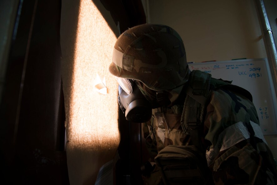 An Airman from the 35th Fighter Wing Comptroller Squadron performs a security check during Phase II of an operational readiness exercise at Misawa Air Base, Japan, Jan. 27, 2014. Security checks are done to ensure authorized personnel enter the secure location.  (U.S. Air Force photo/ Tech. Sgt. Araceli Alarcon)