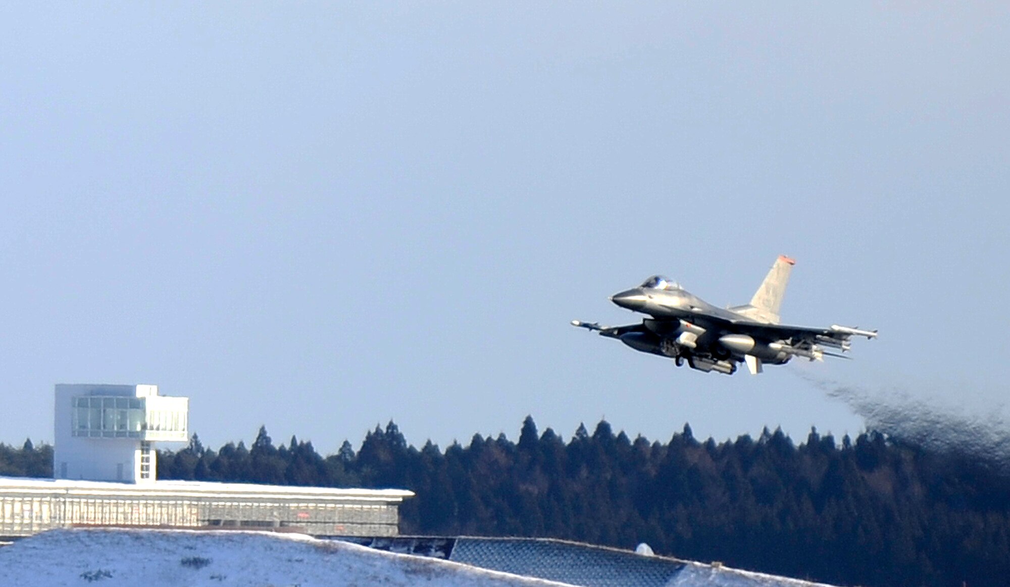 An F-16 Fighting Falcon from the 35th Fighter Wing takes off during an operational readiness exercise at Misawa Air Base, Japan, Jan. 27, 2014. This jet is assigned to the 13th Fighter Squadron, one of several aircraft generated during Phase II of the ORE. (U.S. Air Force photo/Airman 1st Class Patrick S. Ciccarone)