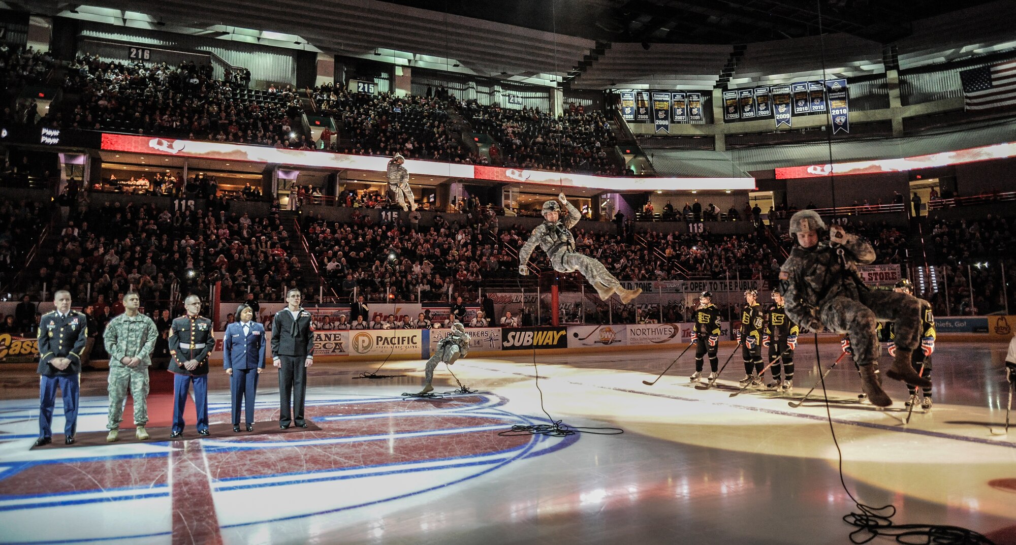 Washington National Guard Soldiers rappel from the rafters to join the opening ceremonies at the Spokane Arena during Military Appreciation Night Jan. 26, at Spokane, Wash. The Spokane Chiefs hosted the Tri-City Americans at Spokane Arena as part of their Military Appreciation Night to honor members of the U.S. Armed Forces and thanked them for their service. (U.S. Air Force photo by Staff Sgt. Alexandre Montes/RELEASED)