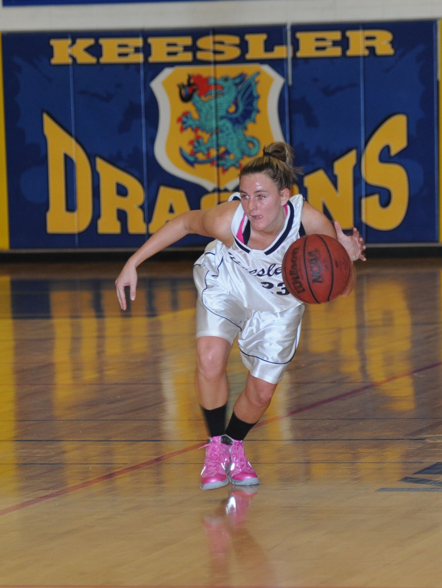 Brittney Deichmann, Keesler, drives the ball down court during a women’s varsity basketball game against Fort Gordon Jan. 25, 2014, Keesler Air Force Base, Miss. Keesler defeated Fort Gordon, 70-37. The men’s team lost to Fort Gordon, 78-88.  (U.S. Air Force photo by Kemberly Groue)