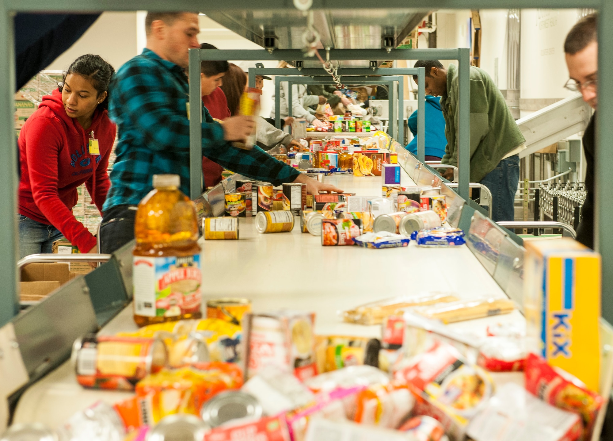 Airmen volunteering with the African American Heritage Council sort donated food while serving at the Second Harvest Food Bank in Spokane, Wash., Jan. 24, 2014. Second Harvest’s mission is fighting hunger and feeding hope by bringing community resources together to feed people in need through empowerment, education and partnerships. (U.S. Air Force photo by Staff Sgt. Benjamin W. Stratton/Released)