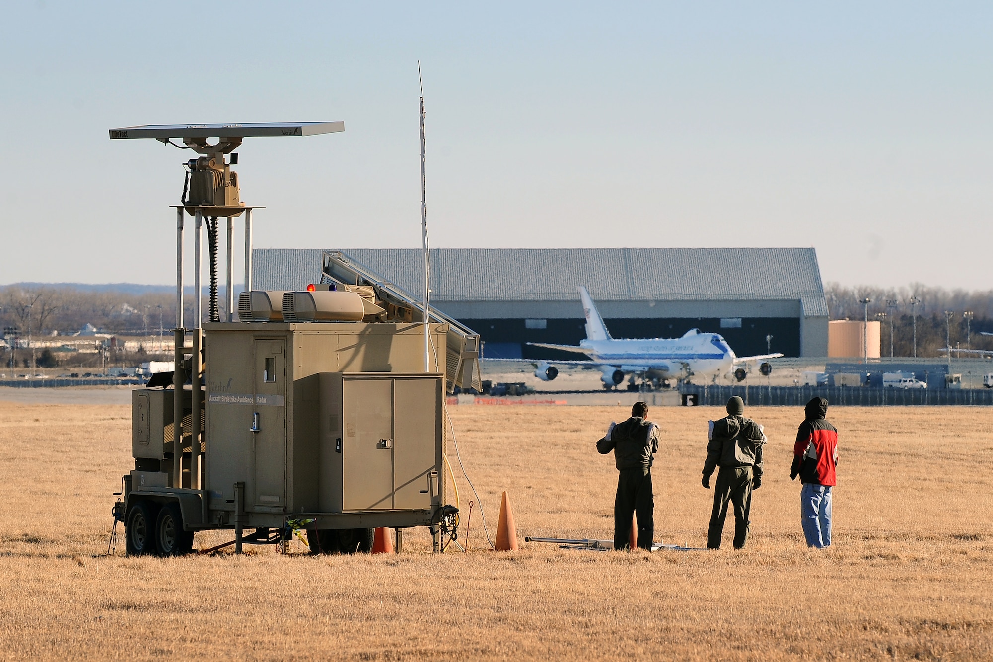 Airmen assigned to the 55th Wing’s Flight Safety office tour the new Merlin Radar placed on the North side of the base runway Jan. 23, Offutt Air Force Base, Neb. The new radar detects birds in and around the active runway. Bird migrations pose a significant threat to the wing’s aircraft with a single bird collision costing millions of dollars in damage and the threat of lives lost. (U.S. Air Force photo by Josh Plueger/Released)  