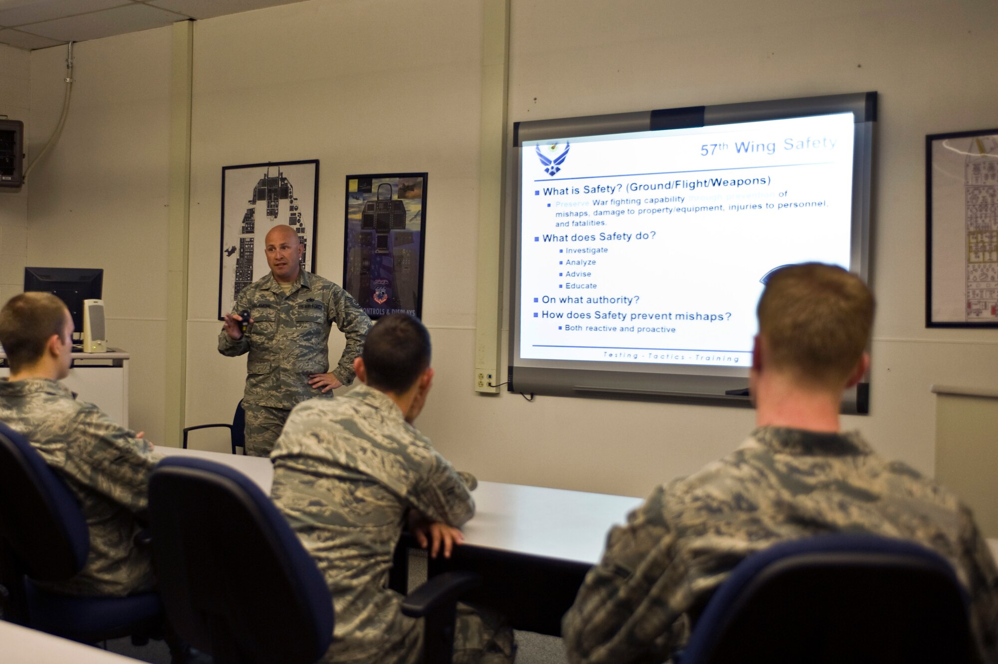 Tech. Sgt. Donald Salamone, 57th Wing flight safety craftsman, gives a safety brief to dedicated crew chiefs in Detachment 13, Jan. 24, 2014, at Nellis Air Force Base, Nev. The 57th Wing safety office conducts flight safety maintenance meetings four times a year to educate Airmen on maintenance trends across the combat Air Force. Maintenance mishaps, how mishaps happen and how to prevent mishaps are issues discussed in the flight safety maintenance meetings.  The U.S. Air Force Warfare Center submitted a quarterly flight safety maintenance meeting to Air Combat Command, and ACC awarded the 57th Wing safety office as a best practice and wants to spread it across other bases. (U.S. Air Force photo by Senior Airman Christopher Tam)