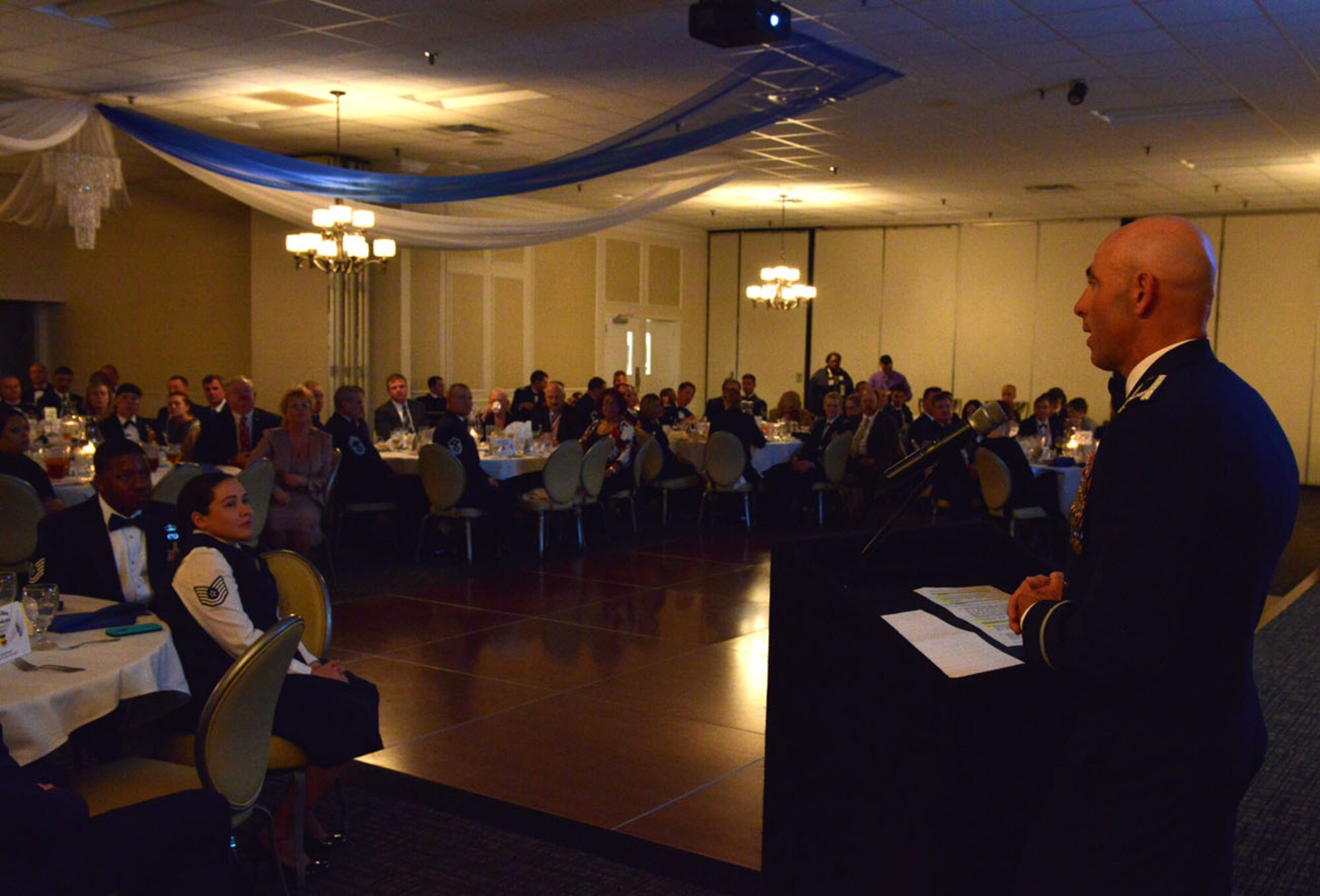 U.S. Air Force Col. Clark Quinn, 20th Fighter Wing vice commander, speaks to Airmen and their families during the 20th FW annual awards ceremony at Shaw Air Force Base, S.C. Jan. 25, 2014. Quinn congratulated not only the award winners, but also all of the nominees and their families for their hard work, support and dedication to their jobs. (U.S. Air Force photo by Airman 1st Class Jensen Stidham/Released) 