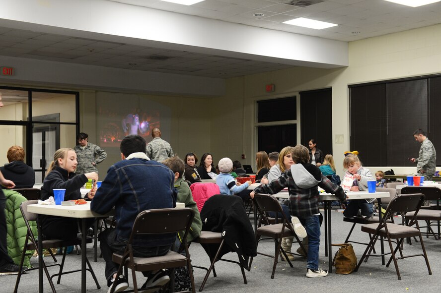 Families gather at the Hearts Apart event on Shaw Air Force Base, S.C., Jan. 24, 2014. Food and board games were supplied for the families while mothers waited to have their picture taken to send to their spouses who are deployed. (U.S. Air Force photo by Airman 1st Class Diana M. Cossaboom/Released)