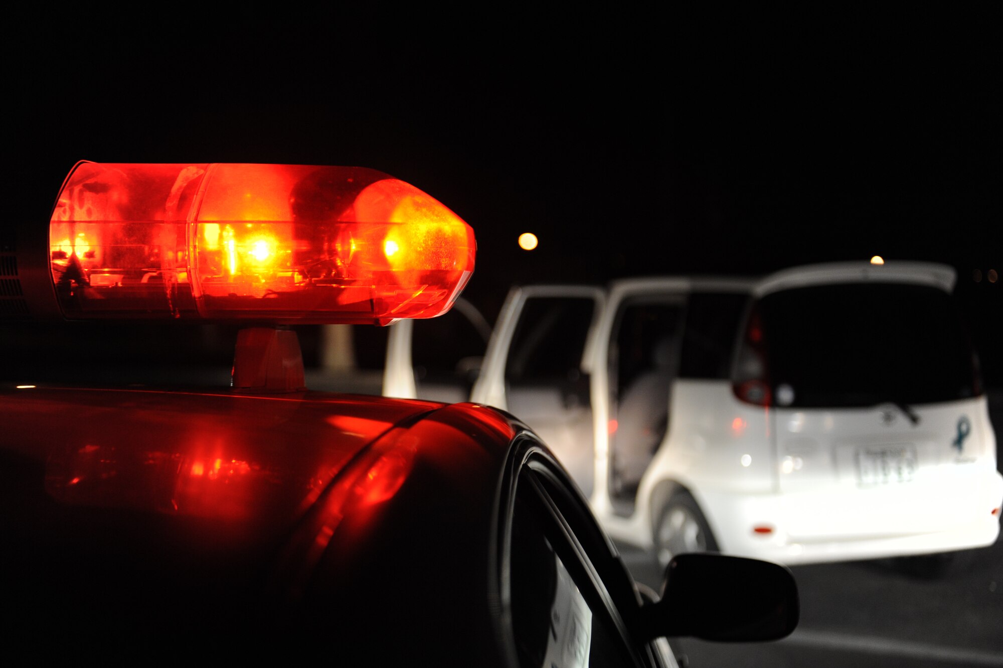 Security Forces remains vigilant as an unauthorized vehicle is searched for unexploded ordnances during a Mission Focused Exercise on Kadena Air Base, Japan, Jan. 28, 2014. MFEs are used to prepare and test mission capabilities of Airmen across the base for future real-world contingencies. (U.S. Air Force photo by Senior Airman Malia Jenkins) 
