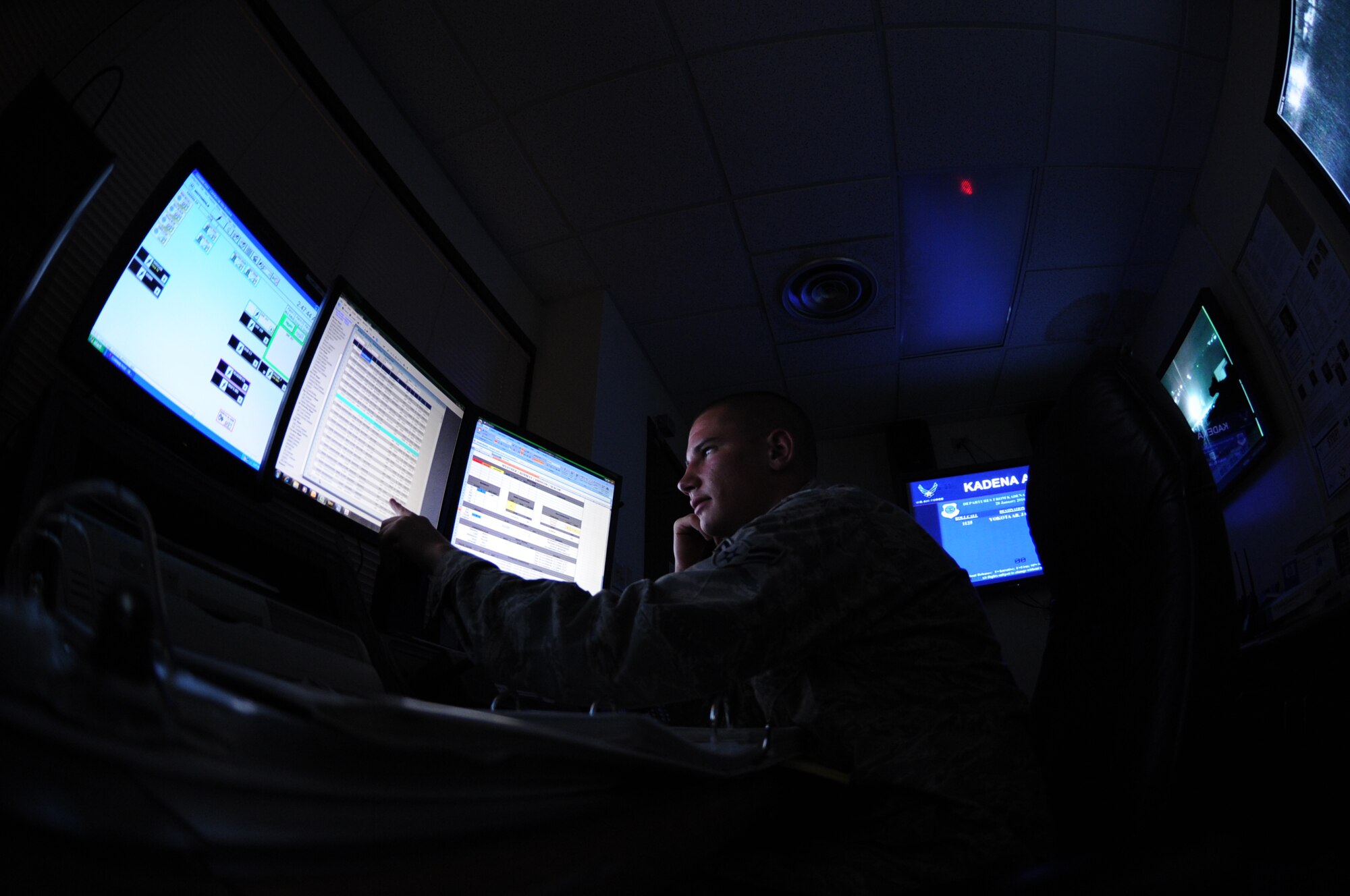 U.S. Air Force Airman 1st Class Dillon Swenson, 18th Command Post emergency actions controller, receives and disseminates an emergency action message during a Mission Focused Exercise on Kadena Air Base, Japan, Jan. 28, 2014. MFEs, which recently replaced local operation readiness exercises, are designed to test Airmen's skills and readiness in preparation for real-world contingencies. (U.S. Air Force photo by Airman 1st Class Keith James)