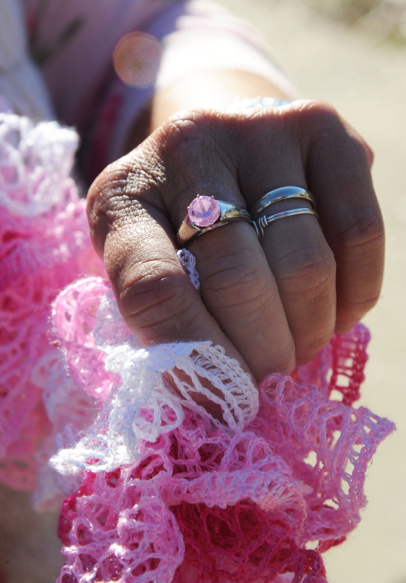 Alison Miller displays a pink ring she wears in memory of her late husband, retired Master Sgt. Chuck Dearing Jan. 16, 2014, at the Keesler Air Force Base camp site, Biloxi, Miss.  Following Dearing’s retirement, the couple sold their home and belongings and to traveled the country for four years staying primarily in base lodgings. Prior to the death of her husband, Miller told him that her intent was to continue traveling in a pink painted car so that he could find her while out on the road.  (U.S. Air Force photo by Kemberly Groue)