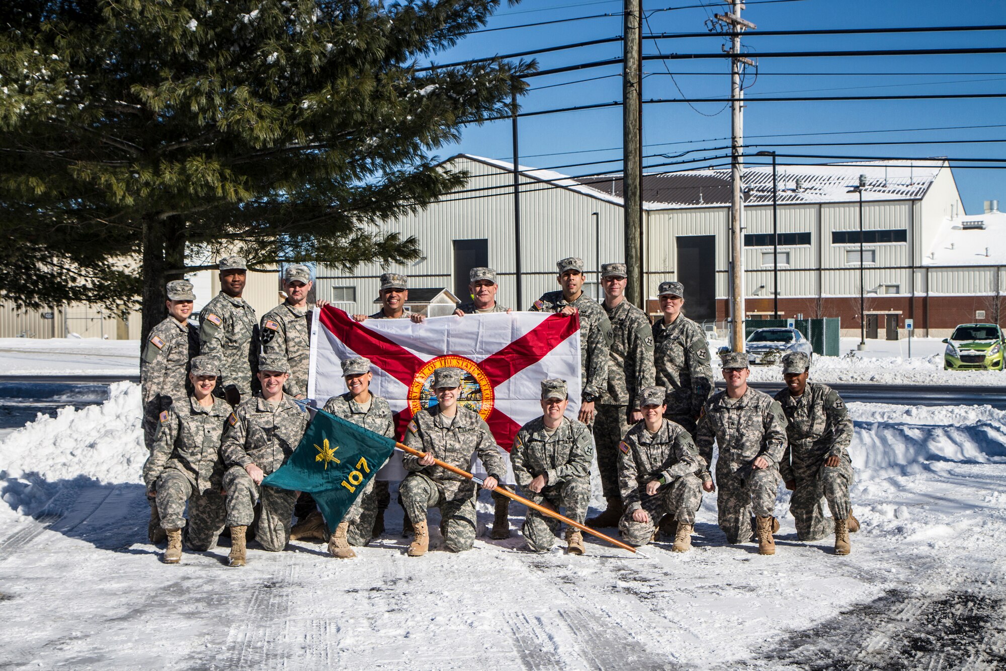 The 107th Mobile Public Affairs Detachment, St. Augustine, Fla., poses for a unit photo at Joint Base Mcguire-Dix-Lakehurst, N.J., Jan. 21. The weather conditions of JB-MDL are a stark contrast to the 107th's home state, with temperatures averaging below 10 degrees. (U.S. Army photo by Sgt. Christopher Vann/Released)