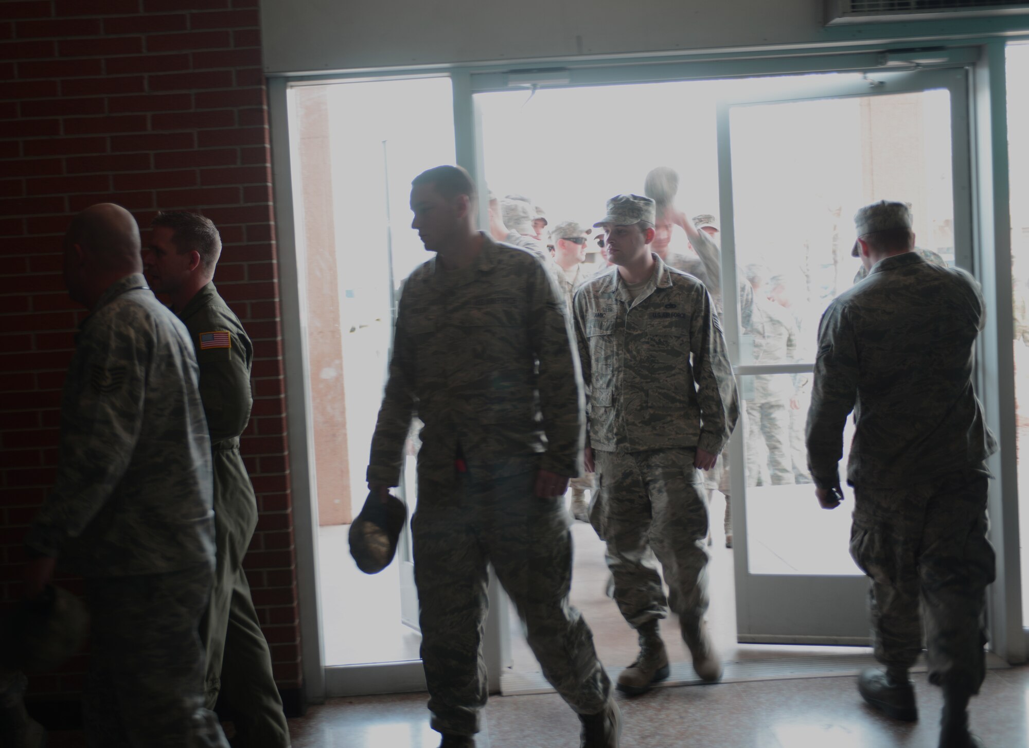 Participants of the combat exercise Red Flag 14-1 enter the Nellis Air Force Base, Nev., theater Jan. 26, 2014, for a series of briefings. Airmen, along with 112 aircraft, are participating in the exercise to be better prepared for deployments. (U.S. Air Force photo by Senior Airman Benjamin Sutton/Released)