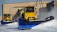 11th Civil Engineer Squadron equipment operators clear snow from the flight line at Joint Base Andrews, Md., Jan. 23, 2014. As colder temperatures surround the installation, team members remain on-call and ready to assemble within moments. Nights before forecasted flurries, personnel arrive to work hours before precipitation hits, standing ready to move as soon as the first flake falls. (U.S. Air Force photo / Airman 1st Class Nesha Humes)