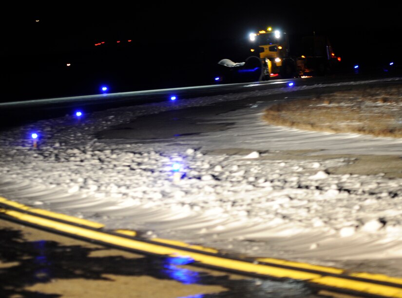 11th Civil Engineer Squadron equipment operators push snow off the flight line at Joint Base Andrews, Md., Jan. 23, 2014. The equipment operator’s daily mission stops when snow comes down and they switch over from normal eight to continuous twelve-hour shifts until the flight line is snow and ice free. (U.S. Air Force photo / Airman 1st Class Nesha Humes)