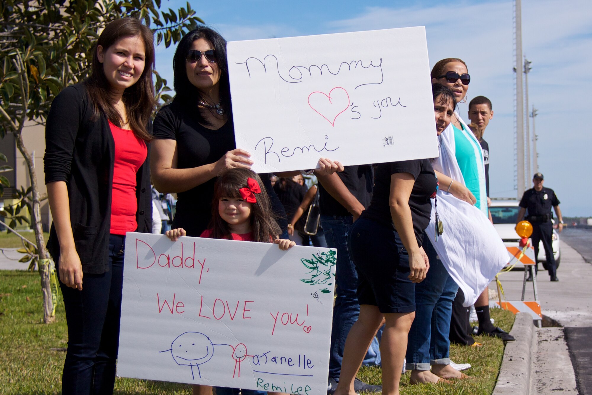 Friends and family members line up, waiting to wave goodbye as the bus, full
of deploying Airmen, drives past on the way to the aircraft at Homestead Air
Reserve Base, Fla., in January. More than 300 Airmen from the base deployed
to Southwest Asia and Europe in support of contingency operations. (U.S. Air
Force photo by/Tech. Sgt. Lionel Castellano)
