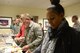 Dorm residing Airmen get food during the Single Enlisted E4 and Below dorm dinner at Shaw Air Force Base, S.C., Jan 23, 2014. The SEE4B dorm dinners are nights where a unit on base gets volunteers to serve a dinner that is open to all the single Airmen living in the dorms. (U.S. Air Force photo by Airman 1st Class Jonathan Bass/Released)