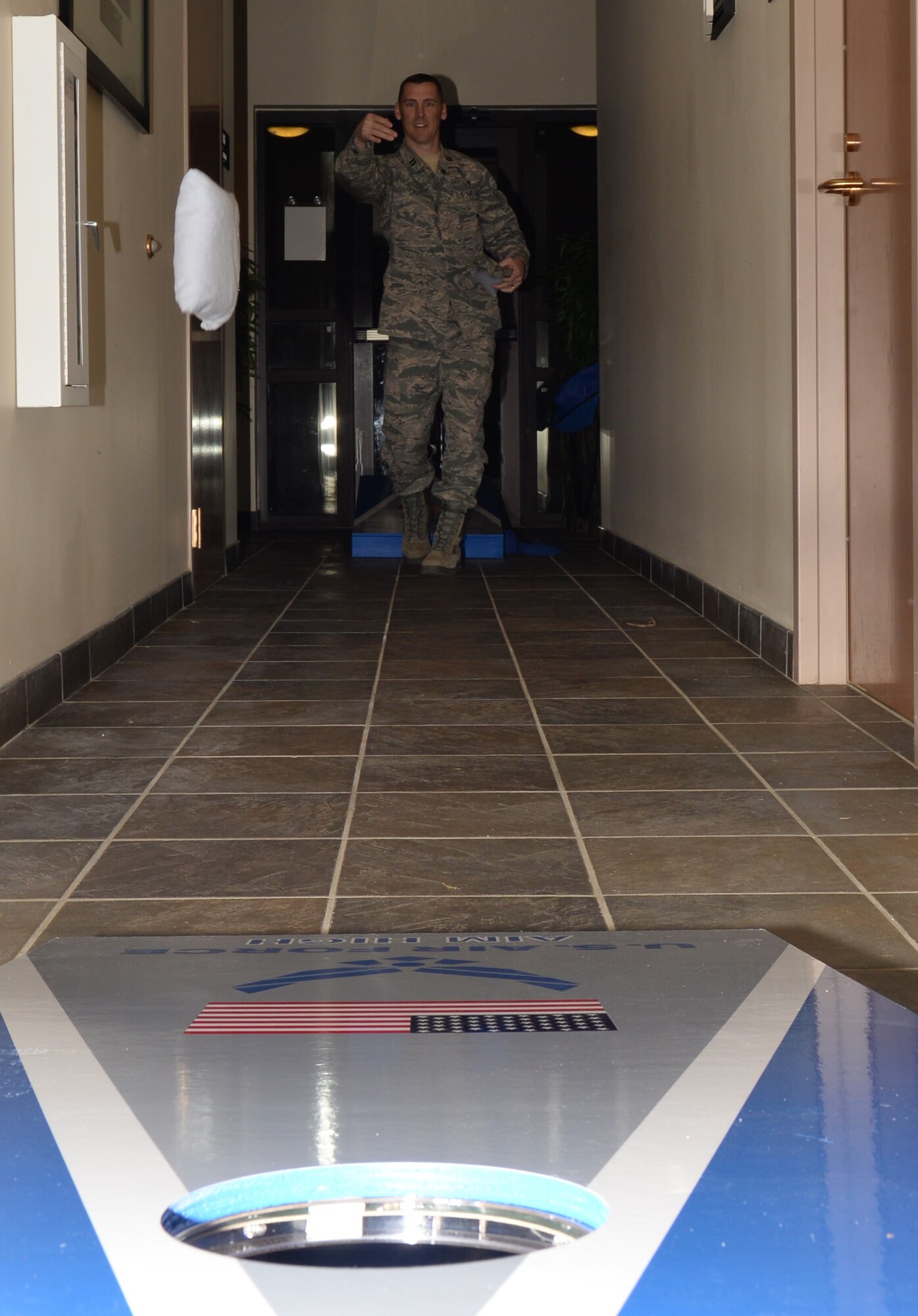 U.S. Air Force Chaplain (Capt.) Randy Croft, 20th Fighter Wing chaplain, plays a bean bag toss game at the Single Enlisted E4 and Below dorm dinner at Shaw Air Force Base, S.C., Jan 23, 2014. The SEE4B leadership team holds dorm dinners throughout the year for units on base to host and give back to their junior enlisted Airmen living on base. (U.S. Air Force photo by Airman 1st Class Jonathan Bass)