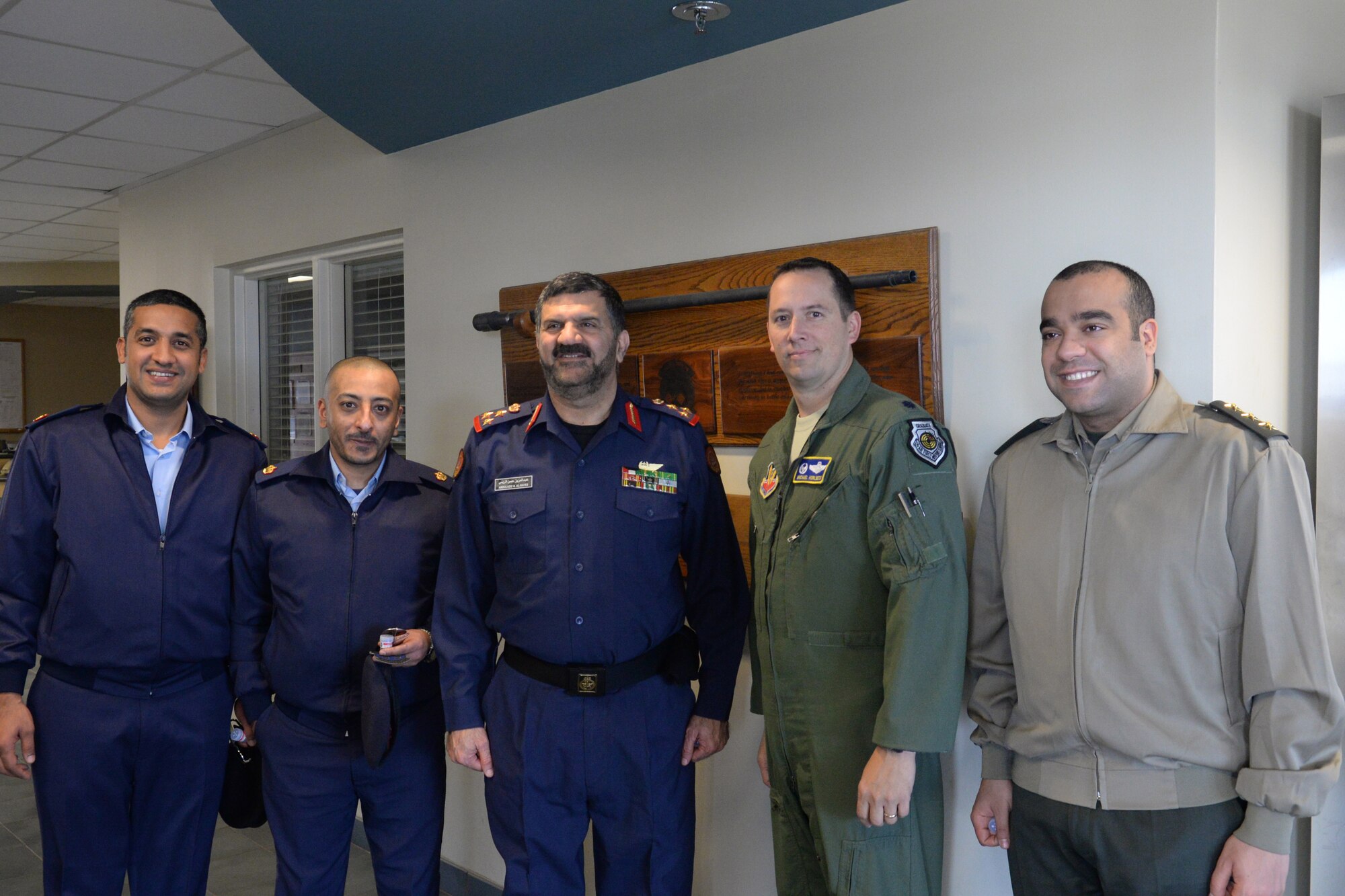Members of the Kuwait Ministry of Defense pose for a photo with U.S. Air Force Lt. Col. Michael Horlbeck, 55th Fighter Squadron commander, at the 55th FS building, Jan. 21, 2014, Shaw Air Force Base, S.C. the Kuwaiti delegation received a briefing on the mission and daily schedule of the 55th FW from Horlbeck. (U.S. Air Force photo by Airman 1st Class Jonathan Bass/Released)