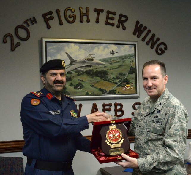 Staff Brig. Gen. Abd-al-Aziz Husn Al-Reyes, Kuwait Ministry of Defense director of moral guidance and public relations (left), presents a plaque to U.S. Air Force Col. Scott Arcuri, 20th Mission Support Group commander, in recognition of the international cooperation between the Kuwaiti military and the United States Air Force, Shaw Air Force Base, S.C., Jan. 21, 2014. Arcuri gave a briefing to the brigadier general and his officers on the mission of Shaw AFB. (U.S. Air Force photo by Airman 1st Class Jonathan Bass/Released)
