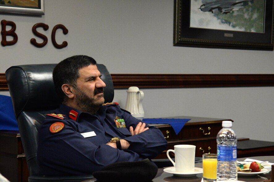Staff Brig. Gen. Abd-al-Aziz Husn Al-Reyes, Kuwait Ministry of Defense director of moral guidance and public relations, listens to a briefing on the mission of the 20th Fighter Wing in the headquarters conference room, Shaw Air Force Base, S.C., Jan. 21, 2014. Al-Reyes, along with three of his officers, toured Shaw AFB and got a look at the inner workings of the base. (U.S. Air Force photo by Airman 1st Class Jonathan Bass/Released)