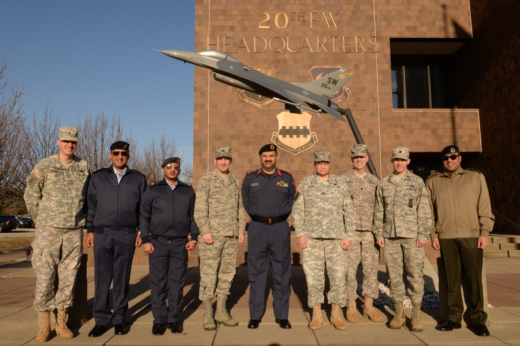 20th Fighter Wing, U.S. Army Central, and Kuwait Ministry of Defense members pose for a photo outside the 20th FW headquarters building, Jan. 21, 2014, Shaw Air Force Base, S.C. The Kuwaiti delegation toured Shaw and spent time learning about Shaw’s mission. (U.S. Air Force photo by Airman 1st Class Jonathan Bass/Released)