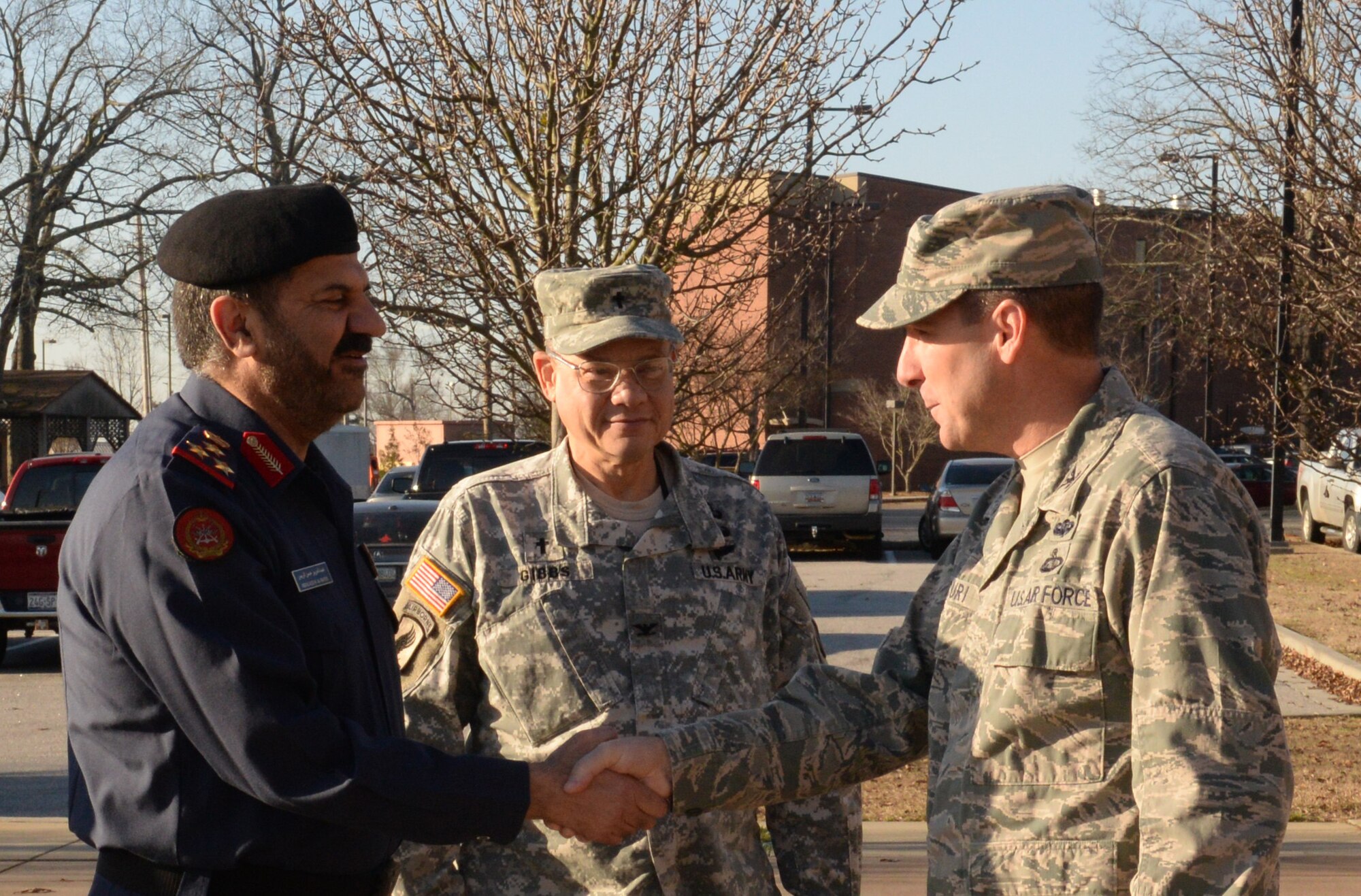 U.S. Air Force Col. Scott Arcuri, 20th Mission Support Group commander (right), shakes the hand of Staff Brig. Gen. Abd-Al-Aziz Husn Al-Reyes, Kuwait Ministry of Defense director of moral guidance and public relations (left) as U.S.  Army Chaplain (Col.) Jonathan Gibbs, U.S. Army Central command chaplain, introduces them, Jan. 21, 2014, Shaw Air Force Base, S.C. Arcuri met with the brigadier general’s delegation that morning to brief the group on the mission of Shaw AFB. (U.S. Air Force photo by Airman 1st Class Jonathan Bass/Released)