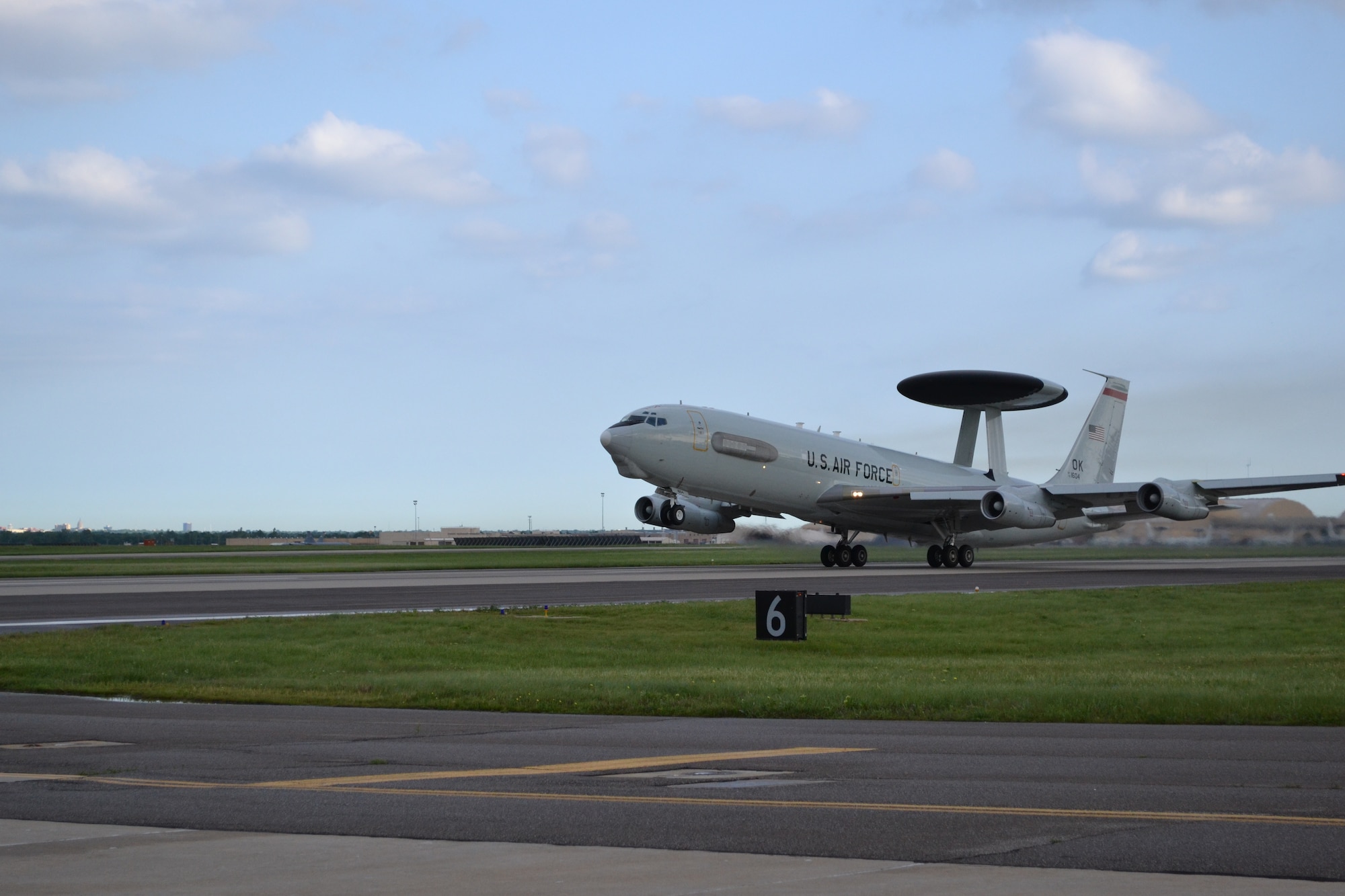 An E-3 “Sentry” Airborne Warning and Control System aircraft lifts off of Tinker’s north/south runway en route to a recent mission. (Air Force photo by Darren D. Huesel)