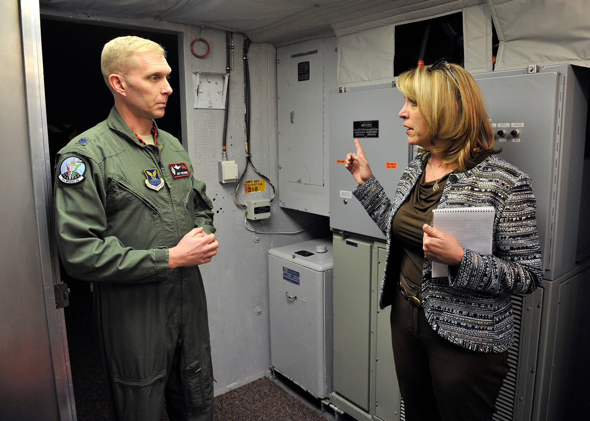 Secretary of the Air Force Deborah Lee James discusses missile crew manning with Lt. Col. Jeffrey Voetberg, 12th Missile Squadron commander, while touring Missile Alert Facility India-01’s underground Launch Control Capsule January 21, 2014. India-01 is located near Great Falls, Mont., and is one of 15 MAFs assigned to the 341st Missile Wing. (U.S. Air Force photo by John Turner)