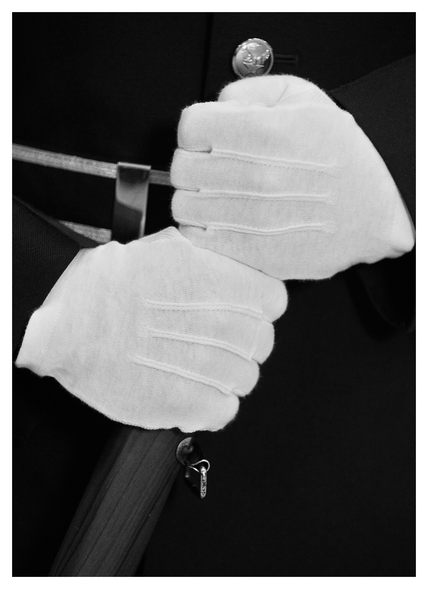 The first position honor guard member holds the tip of a ceremonial rifle in a modified form of parade rest, Dec. 20 at Tyndall. In 2013 the base honor guard participated in 80 official ceremonies with a drop in personnel from 59 to 32 members. (U.S. Air Force photo illustration by Staff Sgt. Javier Cruz)