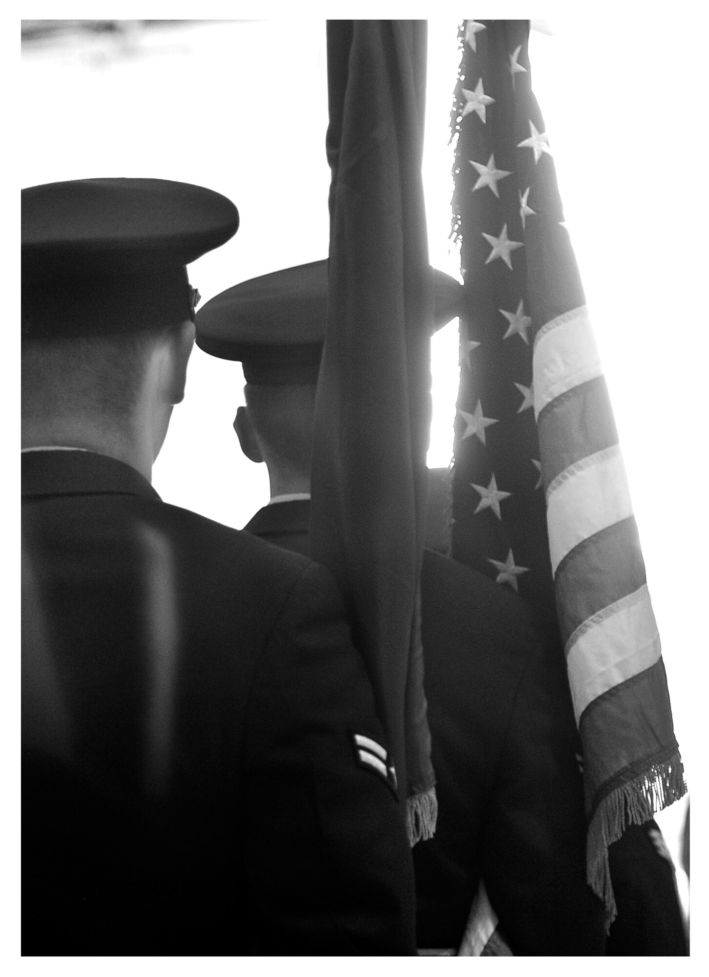 Members of the base honor guard march towards and open hangar door after completing the opening ceremony of a change of command, Dec. 20 at Tyndall. In 2013 the base honor guard participated in 80 official ceremonies with a drop in personnel from 59 to 32 members. (U.S. Air Force photo illustration by Staff Sgt. Javier Cruz)