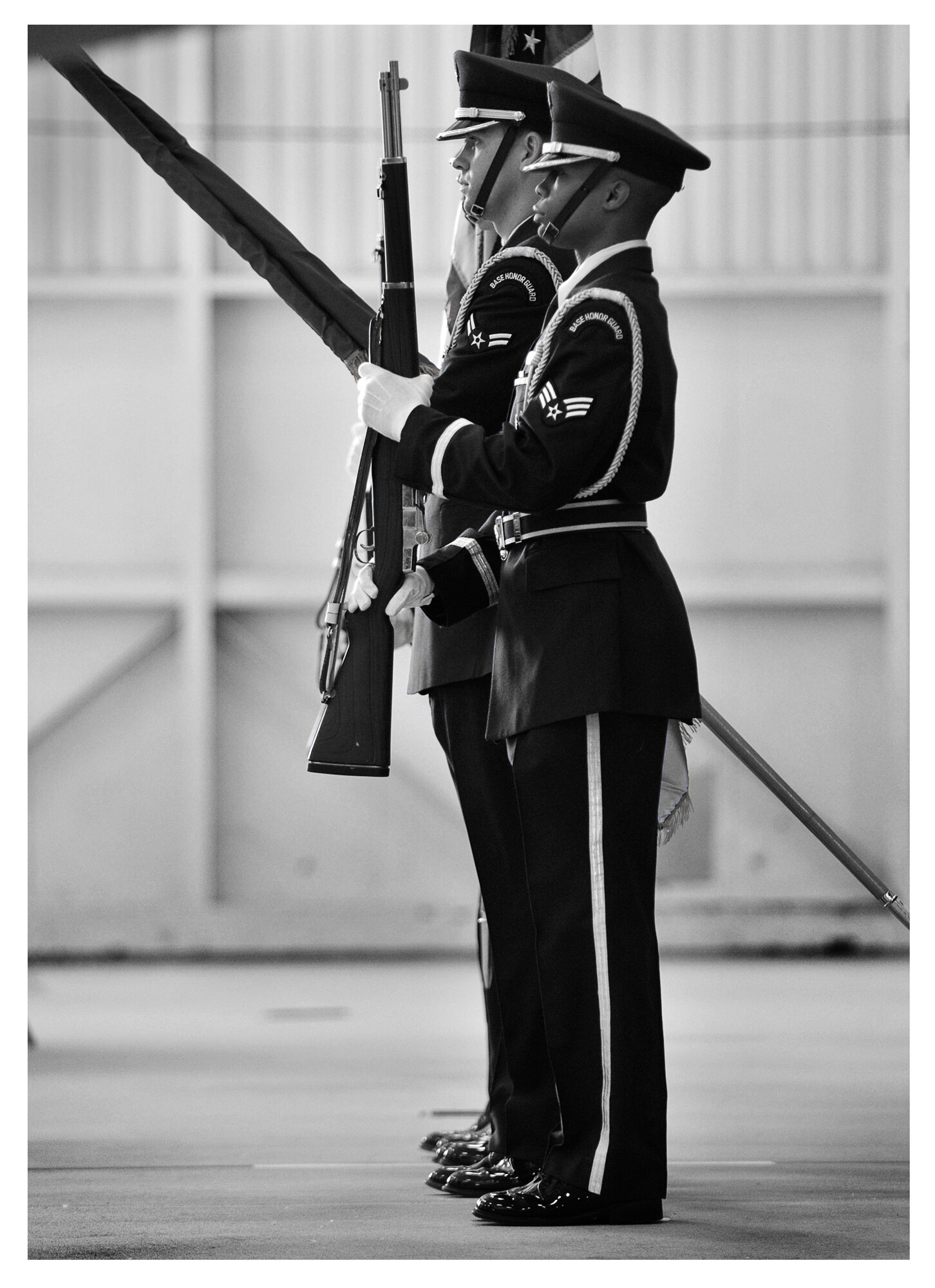 Members of the base honor guard perform facing movements at the beginning of a change of command ceremony, Dec. 20 at Tyndall. In 2013 the base honor guard participated in 80 official ceremonies with a drop in personnel from 59 to 32 members. (U.S. Air Force photo illustration by Staff Sgt. Javier Cruz)