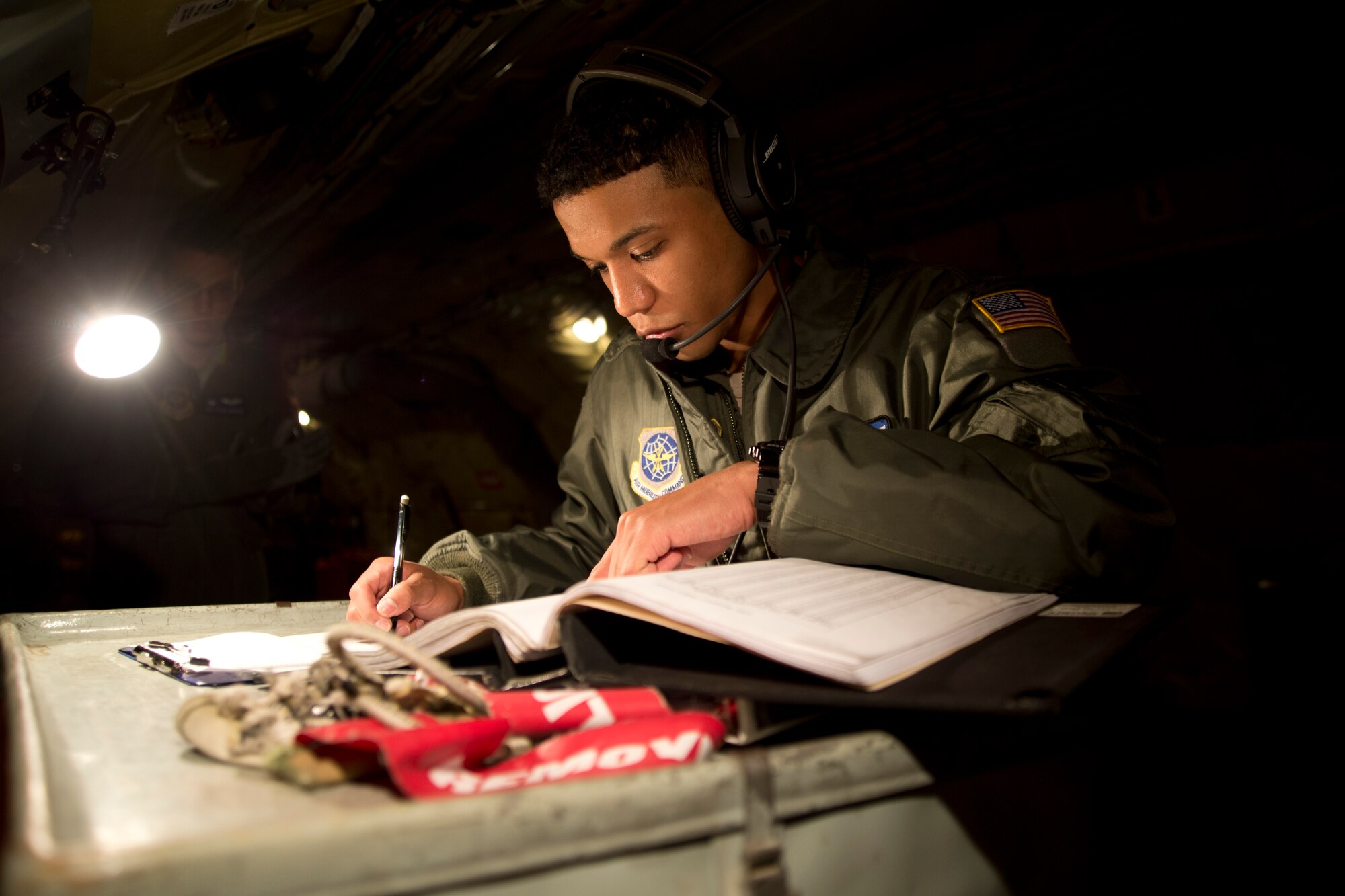 Airman 1st Class Kyle Jackson, 344th Air Refueling Squadron boom operator apprentice, goes over a preflight checklist Jan. 15, 2014, at McConnell Air Force Base, Kan. He is evaluated on his performance by an instructor boom operator. Each passed evaluation brings Jackson closer to becoming a boom operator journeyman. (U.S. Air Force photo/Airman 1st Class John Linzmeier)
