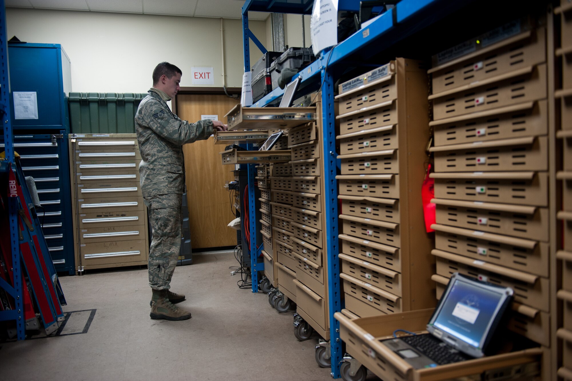 Senior Airman Dante Panicacci, 8th Communications Squadron client systems technician, synchronizes repaired e-Tools Jan. 22, 2014, at Kunsan Air Base, Republic of Korea. E-tools are laptops that hold all of the technical orders a maintainer needs and the 8th CS keeps the e-tools functioning. Before e-tools maintainers would carry their technical orders in several binders. (U.S. Air Force photo by Senior Airman Clayton Lenhardt/Released)