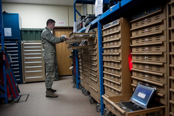 Senior Airman Dante Panicacci, 8th Communications Squadron client systems technician, synchronizes repaired e-Tools Jan. 22, 2014, at Kunsan Air Base, Republic of Korea. E-tools are laptops that hold all of the technical orders a maintainer needs and the 8th CS keeps the e-tools functioning. Before e-tools maintainers would carry their technical orders in several binders. (U.S. Air Force photo by Senior Airman Clayton Lenhardt/Released)