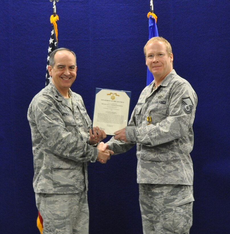 Master Sergeant Steve Schaughency receives the Air Force Commendation Medal (second oak leaf cluster).  MSgt Schaughencey was recognized for his accomplishments as Director of Operations AFCENT Band (May -Nov.2012).