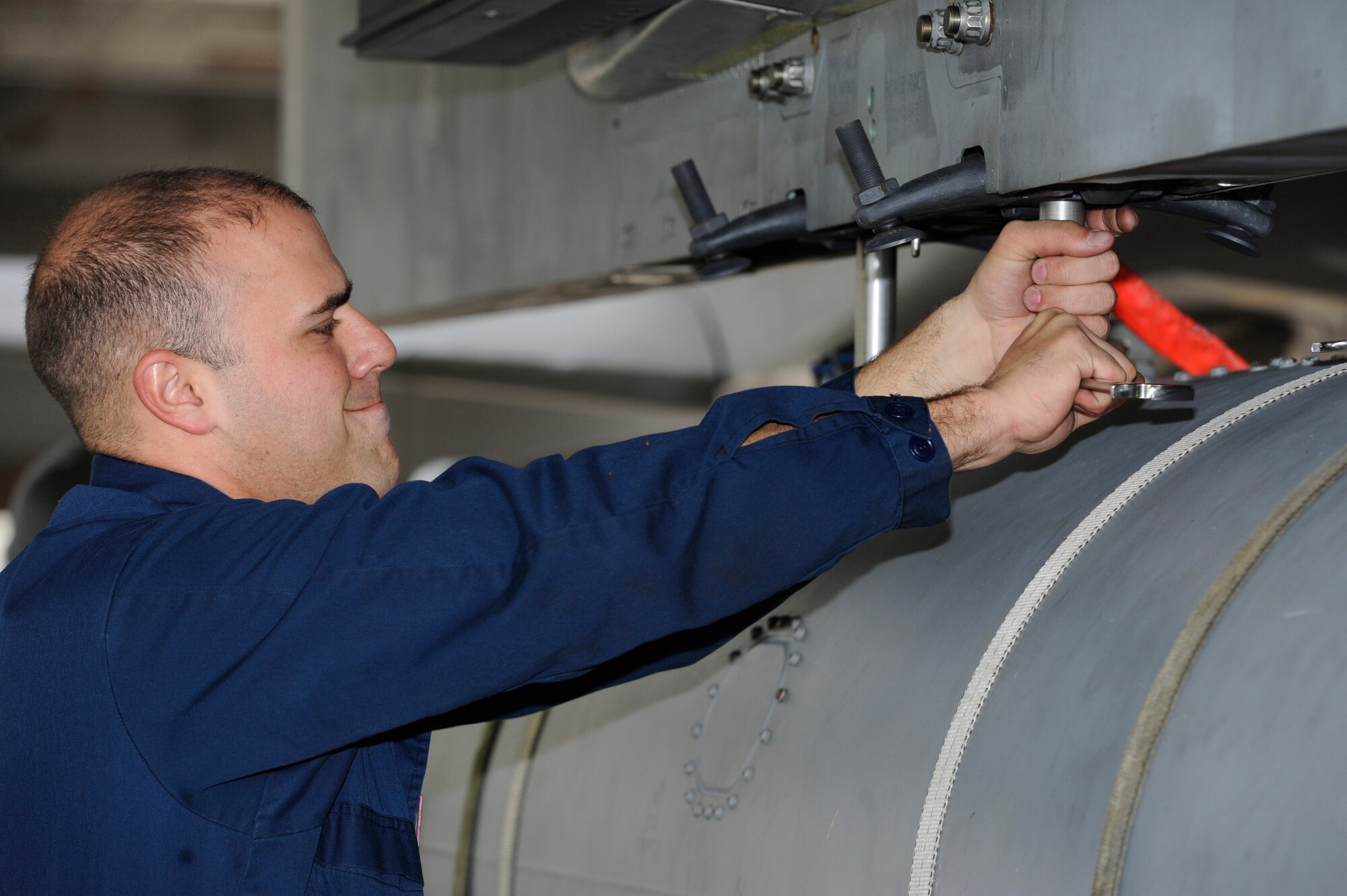 U.S. Air Force Staff Sgt. Brian Daly, 18th Aircraft Maintenance Squadron crew chief, prepares an F-15 Eagle for an external fuel intake during a Mission Focused Exercise on Kadena Air Base, Japan, Jan. 27, 2014. The 18th AMXS had 12 hours to fully generate more than 50 aircraft. (U.S. Air Force photo by Senior Airman Marcus Morris)
