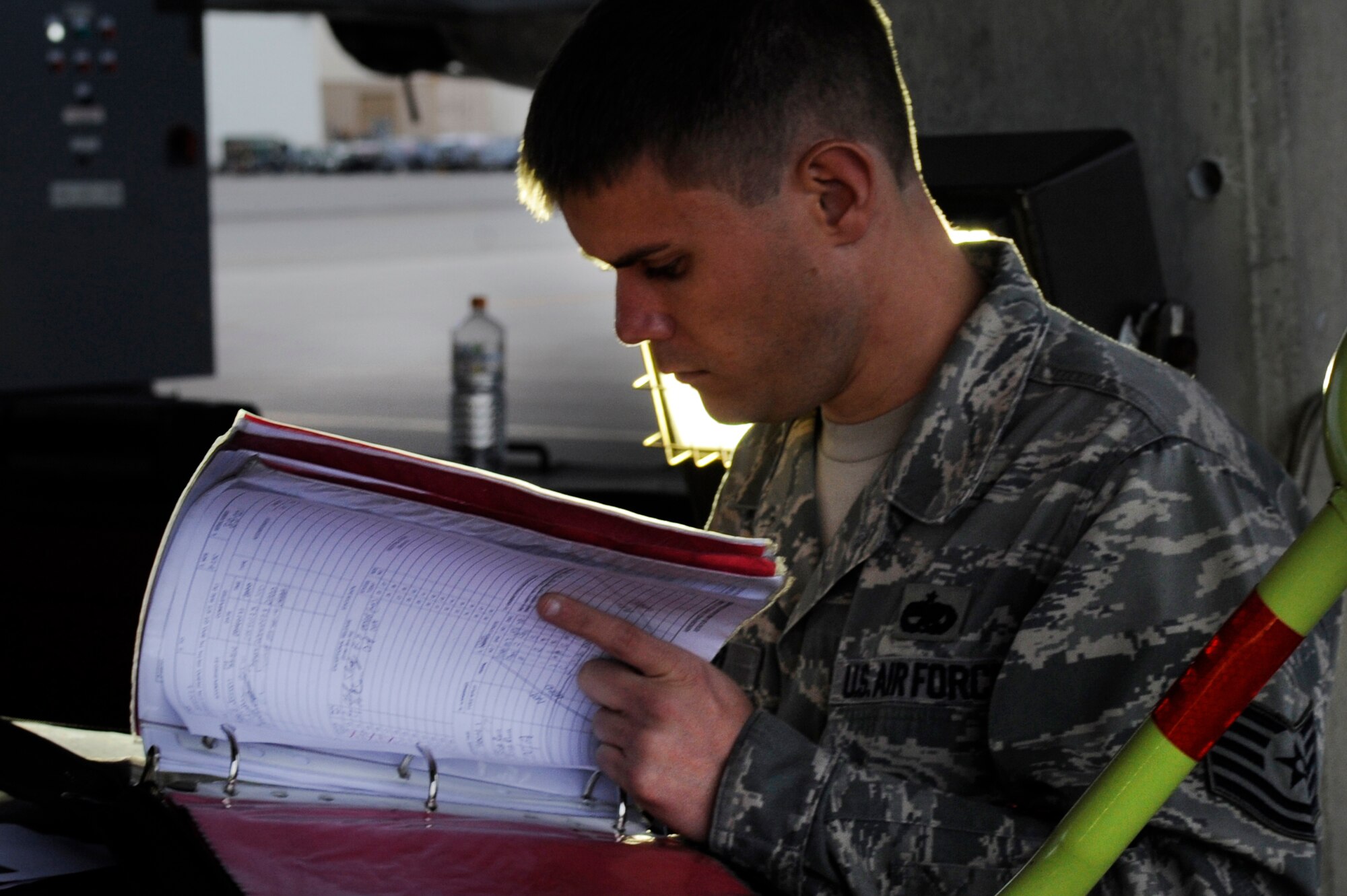 U.S. Air Force Tech. Sgt. Edward Huber, 18th Aircraft Maintenance Squadron electronics and environmental systems specialist, looks over a checklist during a Mission Focused Exercise on Kadena Air Base, Japan, Jan. 27, 2014. The MFE, which is slated to continue through Jan. 30, is the first of its kind on Kadena since the Air Force-wide implementation of the program in October 2013. (U.S. Air Force photo by Senior Airman Marcus Morris)