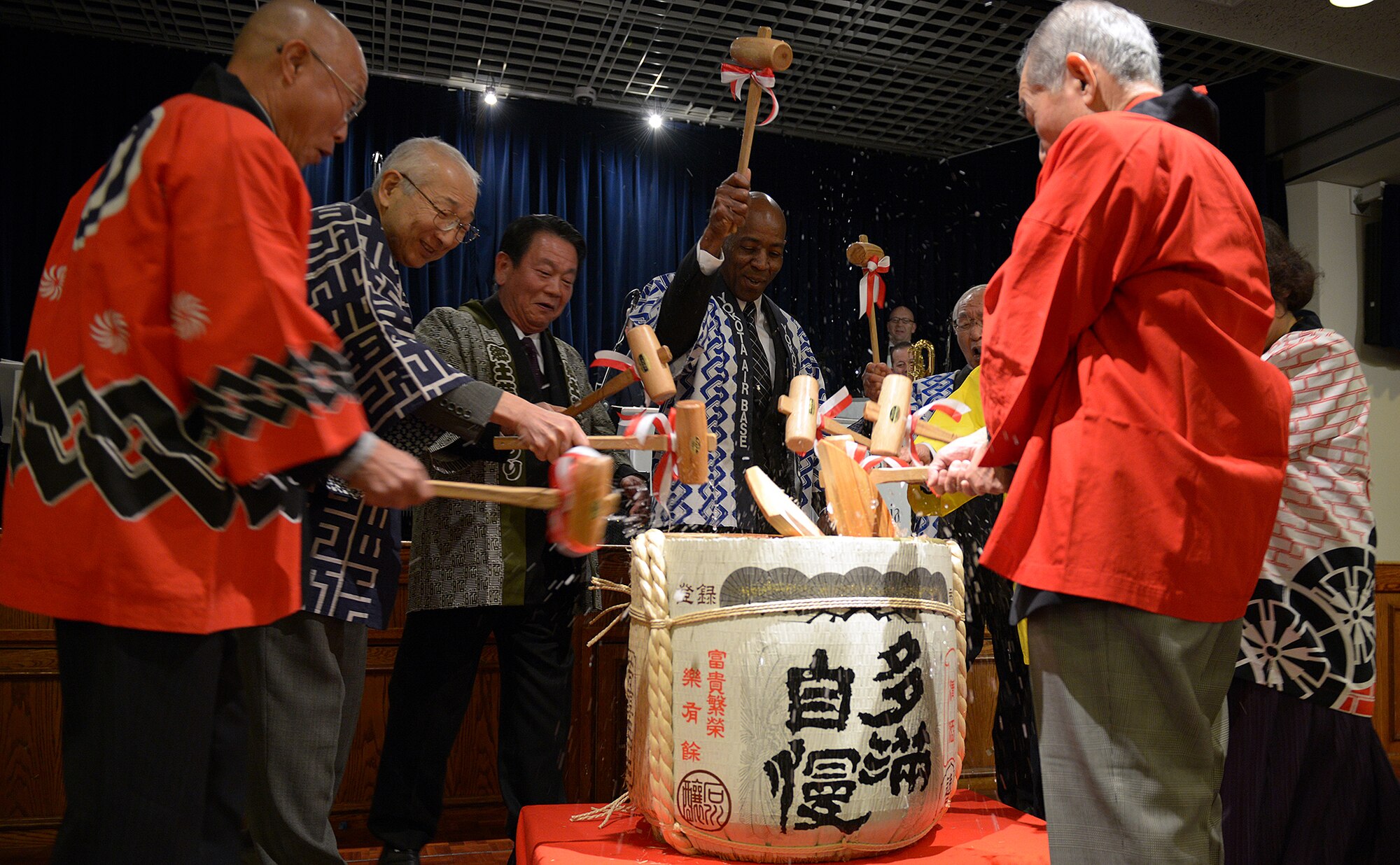 Col. Clarence Lukes, 374th Airlift Wing vice commander, breaks open the New Year’s sake barrel along-side Presidents from the 7 Yokota friendship clubs at Yokota Air Base, Japan, Jan. 25, 2014. (U.S. Air Force photo by Airman 1st Class David Danford/Released)