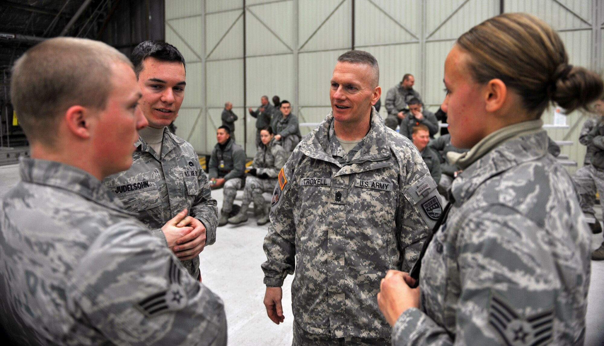 U.S. Army Command Sgt. Maj. John Troxell, U.S. Forces Korea command sergeant major, speaks to members of the 36th Aircraft Maintenance Unit after a quarterly weapons load crew competition at Osan Air Base, Republic of Korea, Jan. 24, 2014. Troxell, who spent the day visiting Team Osan, was impressed by the weapons load crew’s ability to prep their jet and get it ready for combat in a safe and expedient manner. (U.S. Air Force photo/Senior Airman Siuta B. Ika)