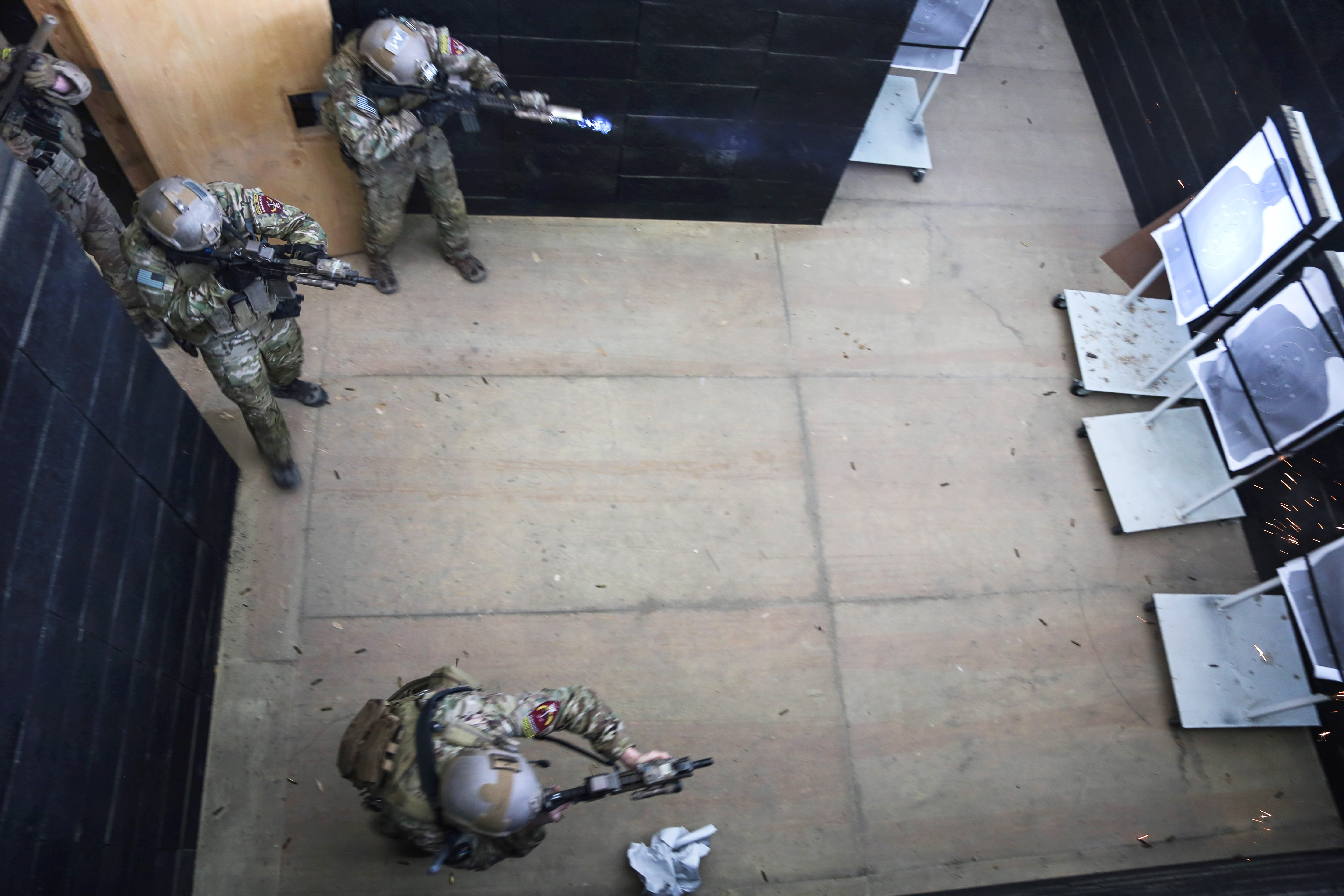 U.S. Special Forces soldiers conduct clearing procedures at a shoot