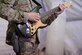 Master Sgt. Toby McWilliams, Air Force Central Command Band guitarist, performs at a concert venue for U.S., Italian and Afghan forces Dec. 14, 2013, at Shindand Airfield, Afghanistan. Mission requirements in Afghanistan require band members, and other service members, to be armed at all times. McWilliams, a Lubbock, Texas, native, is deployed from the Air Force Band of Flight, Wright Patterson, Air Force Base, Ohio. (U.S. Air Force photo by Tech. Sgt. Jason Robertson)

