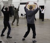 Female poolees conduct physical training with Marines from Marine Corps Recruit Station Twin Cities before going on a hike through the snow, Jan. 26. The pool function lasted two days, and included a wide variety of exercises, classes and opportunities for the poolees to ask learn about the Marine Corps. 
