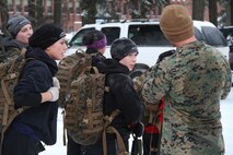 Female poolees hike through the trails around Historic Fort Snelling with the Marines of Marine Corps Recruit Station Twin Cities, Jan. 26. During the hike, the poolees carried rubber rifles and a heavily loaded pack to simulate the burdens they will be expected to carry in Marine recruit training.